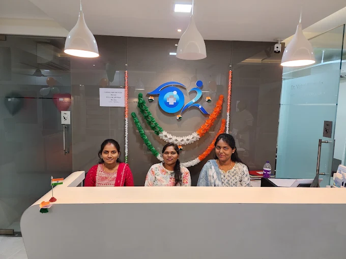 Front desk team assisting patients at Dr. Murkute's O2 Bone & Eye Care Clinic reception, Kharadi, Pune