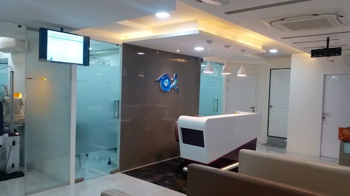 Backlit Dr. Murkute's O2 Bone & Eye Care Clinic logo above the reception counter in Kharadi, Pune